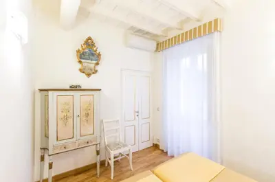 a hallway with a white door and a dining room at Al Centro Storico Roma Suite in Rome