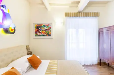 a bedroom with a bed and a window at Al Centro Storico Roma Suite in Rome