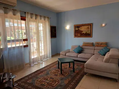 a living room with a couch and a table at Appartamento Isabella in Rome
