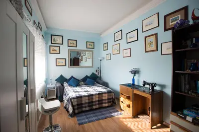 a bedroom with a bed and a desk and a mirror at Simon Holiday House in Rome