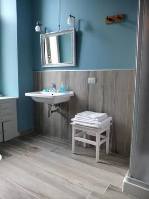 a bathroom with a sink and a mirror at Dimora Al 36 in Rome