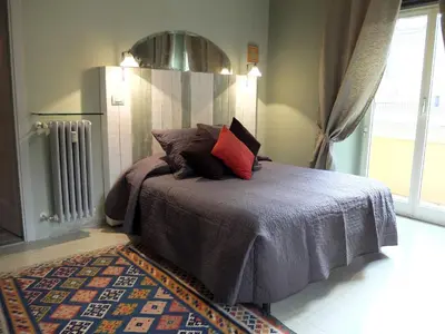 a bedroom with a bed with pillows on it at Dimora Al 36 in Rome