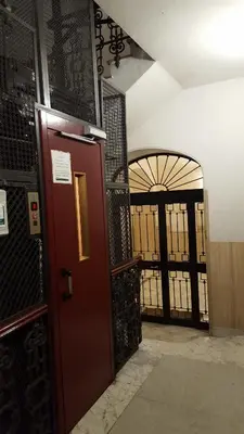 an entrance to a room with a door and a gate at Luiza Vatican House in Rome