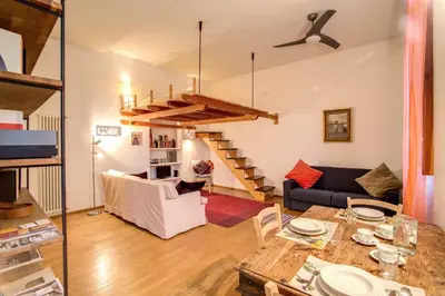 a living room with a couch and a table at Ponte Testaccio Loft in Rome