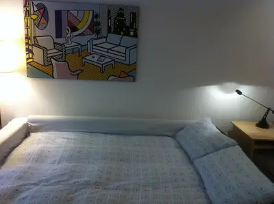 a bedroom with a bed and a painting on the wall at SUITE 14 - Appartamento delizioso in ROMA Centro- 200 mt da METRO B in Rome