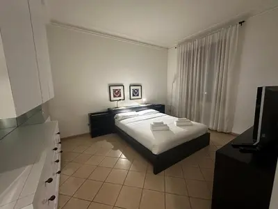 a bedroom with a bed and a television in it at SUITE 14 - Appartamento delizioso in ROMA Centro- 200 mt da METRO B in Rome
