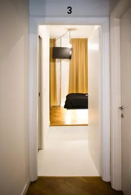 a room with a door leading to a bedroom at Bibi e Romeo's Home in Rome