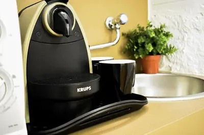a coffee maker sitting on a counter next to a sink at Bibi e Romeo's Home in Rome