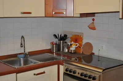 a kitchen with a sink and a counter top at Piazza Meucci in Rome