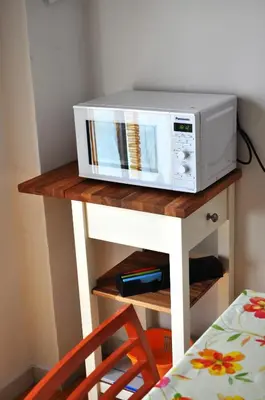 a microwave sitting on top of a table at Piazza Meucci in Rome