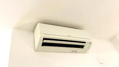 a white toaster oven hanging from a ceiling at Piazza Meucci in Rome