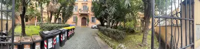 a row of parking meters in front of a building at Napoleone Suite in Rome