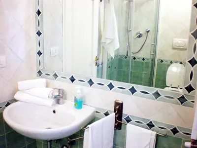 a bathroom with a sink and a mirror at Le Sibille in Rome