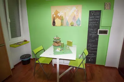 a table and chairs with a cake on top of it at Green Line in Rome