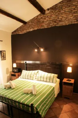 a bedroom with a bed with two towels on it at Sixtythree guesthouse in Rome