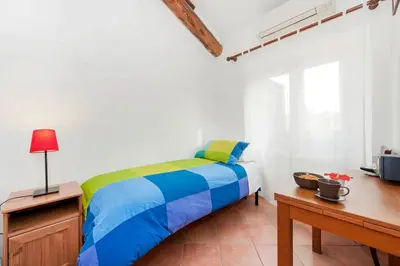 a bedroom with a bed and a table and a desk at Sixtythree guesthouse in Rome