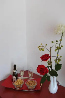a table with a tray of food and glasses of wine at ACasaDiEnza in Rome