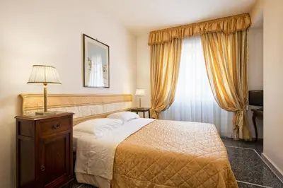 a hotel room with a bed and a window at B&B Le Sibille in Rome