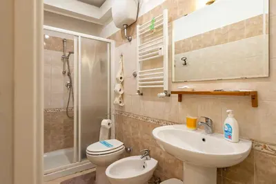 a bathroom with a sink and a toilet and a shower at Domus Clodio in Rome