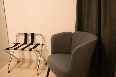 a chair and a table in a room at Trust-Trastevere in Rome