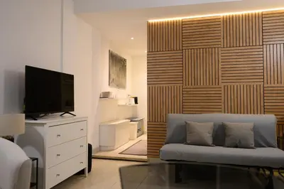 a living room with a couch and a television at Trust-Trastevere in Rome