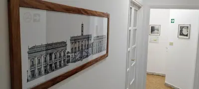 a framed picture of a building on a wall at Trionfal Apartment in Rome