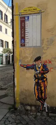 a painting of a woman painted on the side of a wall at Trionfal Apartment in Rome