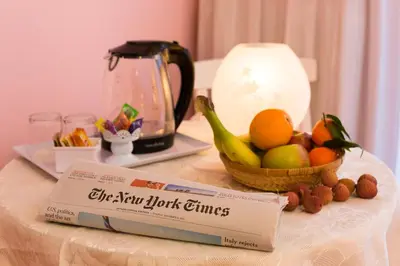 a table with a bowl of fruit and a box on it at Malkavacanze B&B in Rome