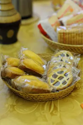 a table with two baskets of pastries on it at La Casa Romana in Rome