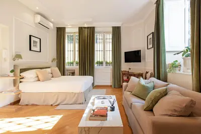 a living room with a bed and a couch at Casa Cucu Piazza del Popolo in Rome