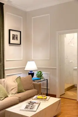 a living room with a couch and a coffee table at Casa Cucu Piazza del Popolo in Rome