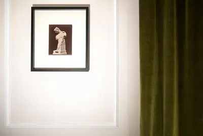 a picture of a woman on a wall with a curtain at Casa Cucu Piazza del Popolo in Rome