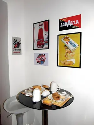 a table with a plate of food on top of it at Breakfast In Bed in Rome