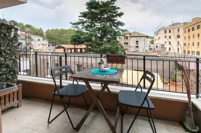a table and two chairs on a balcony at BB Danilo in Rome