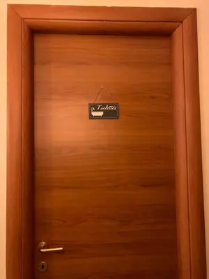a wooden door with a sign on it at BB Danilo in Rome