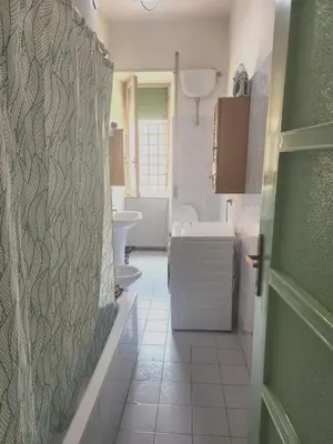 a bathroom with a toilet and a sink at Sepulveda in Rome