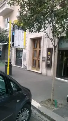 a black car parked in front of a building at Sepulveda in Rome