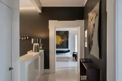 a hallway with black walls and a white door at Piazza di Spagna 9 in Rome