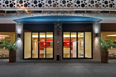 an entrance to a building with a large glass door at Hotel Caravel in Rome