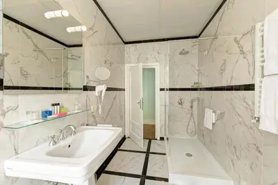 a bathroom with a sink and a tub and a shower at Hotel Quirinale in Rome