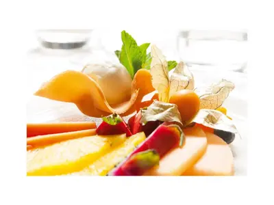 a pile of fruits and vegetables on a plate at Hotel Quirinale in Rome