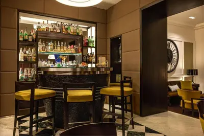 a bar with yellow stools in a restaurant at Hotel Mascagni in Rome