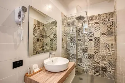 a bathroom with a sink and a shower at Hotel King in Rome