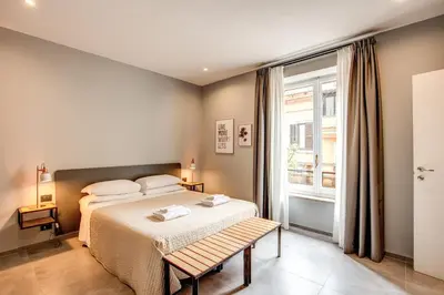a bedroom with a bed and a window at Hotel King in Rome