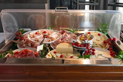 a buffet table with many different types of food at Hotel Isa in Rome