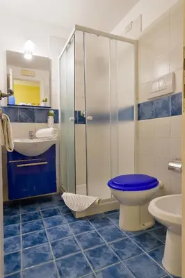 a bathroom with a toilet and a sink and a shower at Barbara Vaticano Affitti Brevi in Rome
