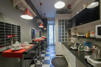 a large kitchen with a long line of counters at Barbara Vaticano Affitti Brevi in Rome