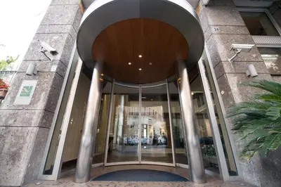 an entrance to a building with a revolving door at Quality Hotel Nova Domus in Rome