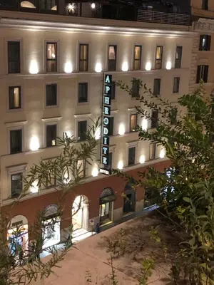 a bathroom with a shower with a tub and a sink at Hotel Aphrodite in Rome