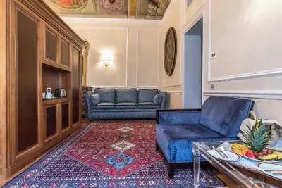 a living room with a couch and a table at Albergo del Senato in Rome